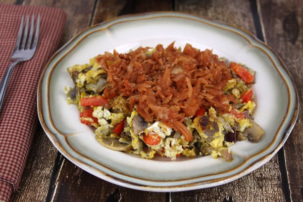 Whole30 Breakfast idea~ Southwest egg scramble topped with Raw Taco Kraut